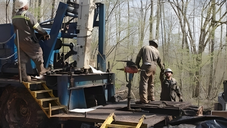 Workers plugging an abandoned oil and gas well to stop methane leaks