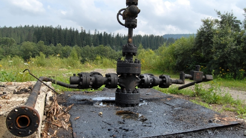 Orphaned oil wellhead awaiting cleanup in rural area